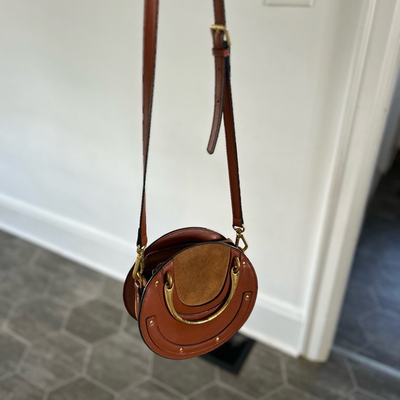 Tan, round, cross body purse - Picture 1 of 5